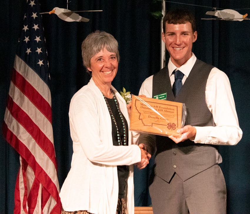 Danelle Crary receiving the Outanding 4-H Alumni Award